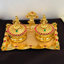 Golden Kumkum Box Set with Krishna Idols and Stone Embellishments  Description: