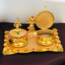 Golden Kumkum Box Set with Krishna Idols and Stone Embellishments  Description: