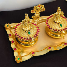 Golden Kumkum Box Set with Krishna Idols and Stone Embellishments  Description: