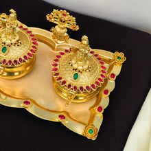 Golden Kumkum Box Set with Krishna Idols and Stone Embellishments  Description: