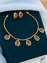 Premium Gold Finish Floral Necklace Set with Green Stone Pendant & Matching Earrings