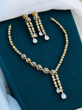 Premium Gold Finish Floral Necklace Set with Green Stone Pendant & Matching Earrings