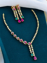 Premium Gold Finish Floral Necklace Set with Green Stone Pendant & Matching Earrings